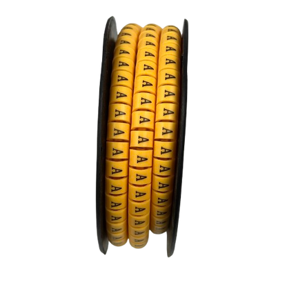 Cable Marker - A Yellow spool of embossed A letter cable markers on a black reel for wire labeling