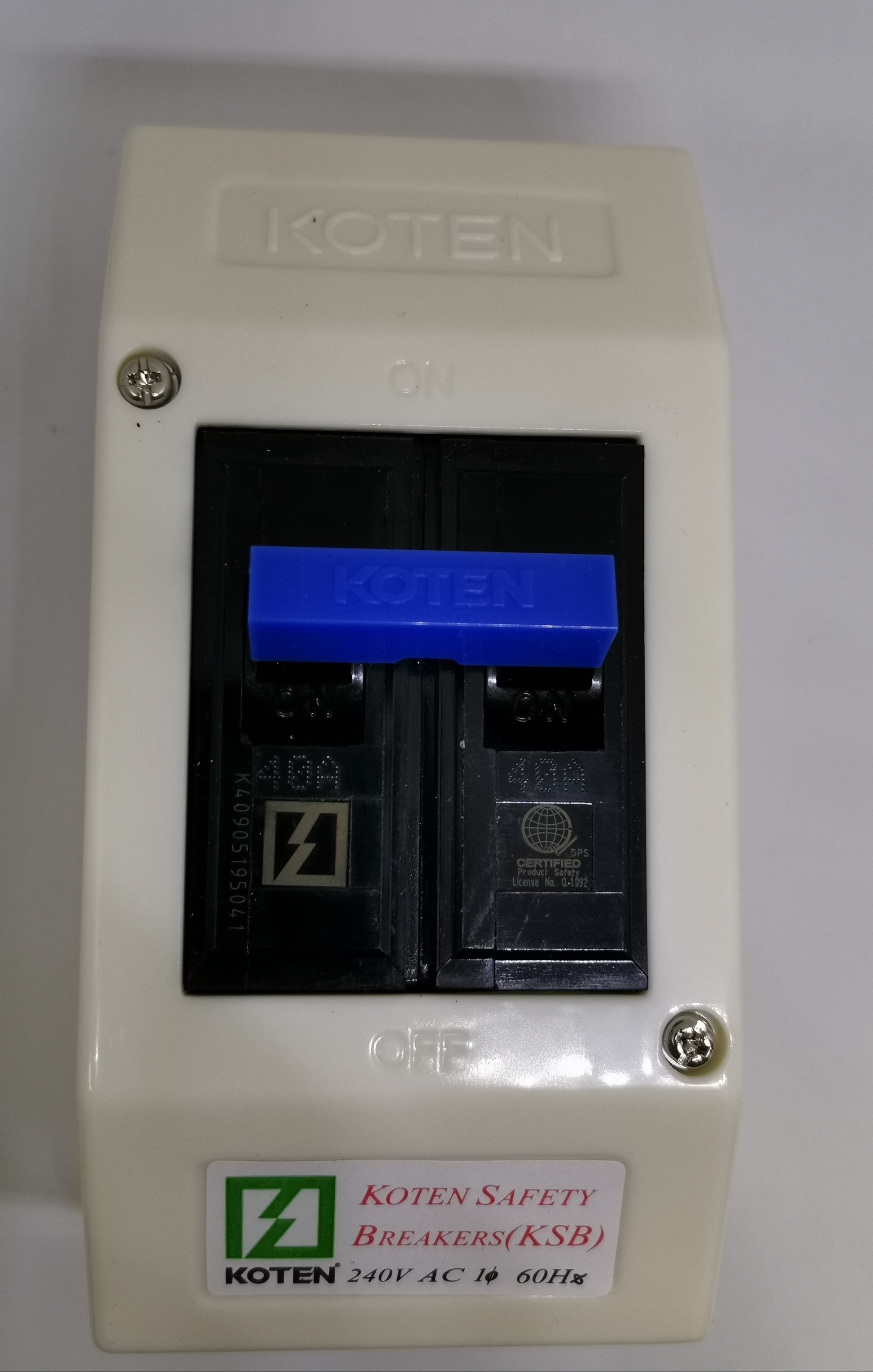 Koten single pole blue toggle on KSB 60A Circuit Breaker with PVC Enclosure. White PVC box, screws visible