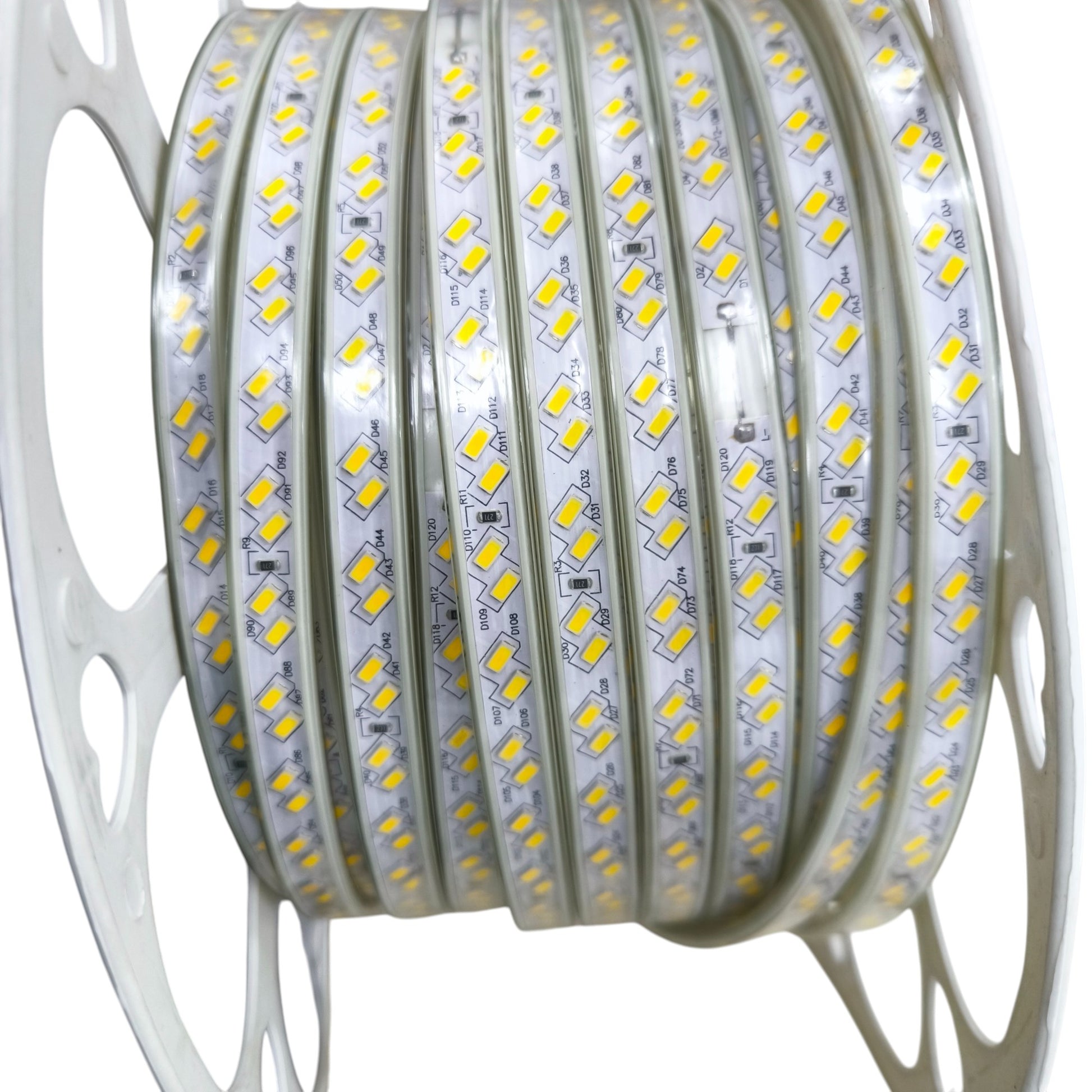 Reel of LED SMD strip light daylight 6500K per meter with yellow SMD chips on white flexible strip