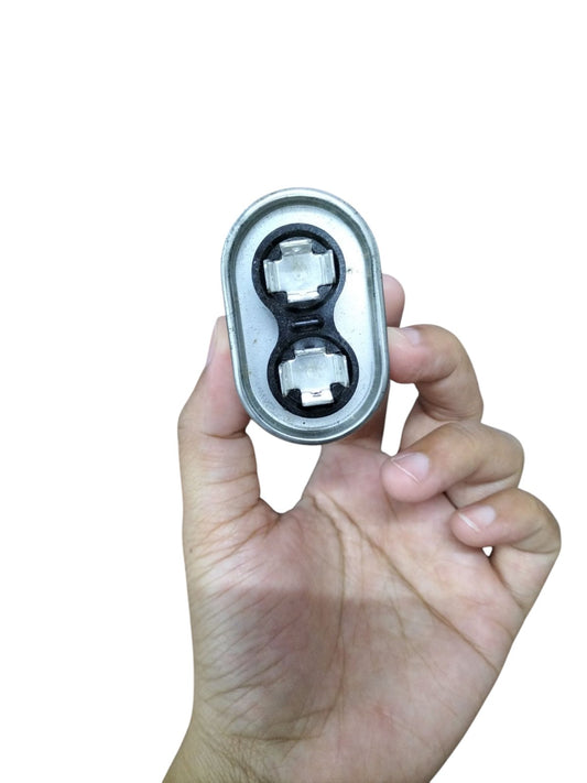 Mallory 3UF 440V oil-filled capacitor held in hand for easy viewing and installation