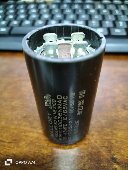 Mallory motor capacitor black cylindrical electrical part with metal terminals