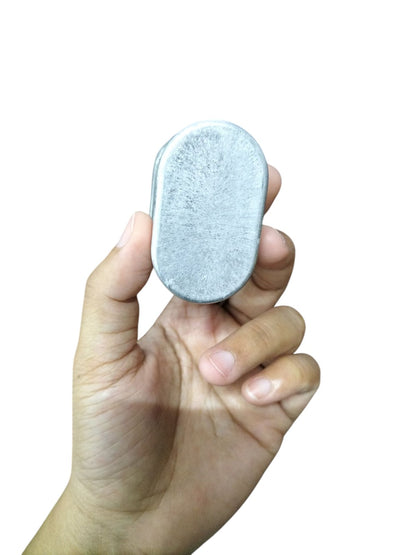 Mallory oil-filled running capacitor 440V AC held in hand, compact metal design for efficient performance