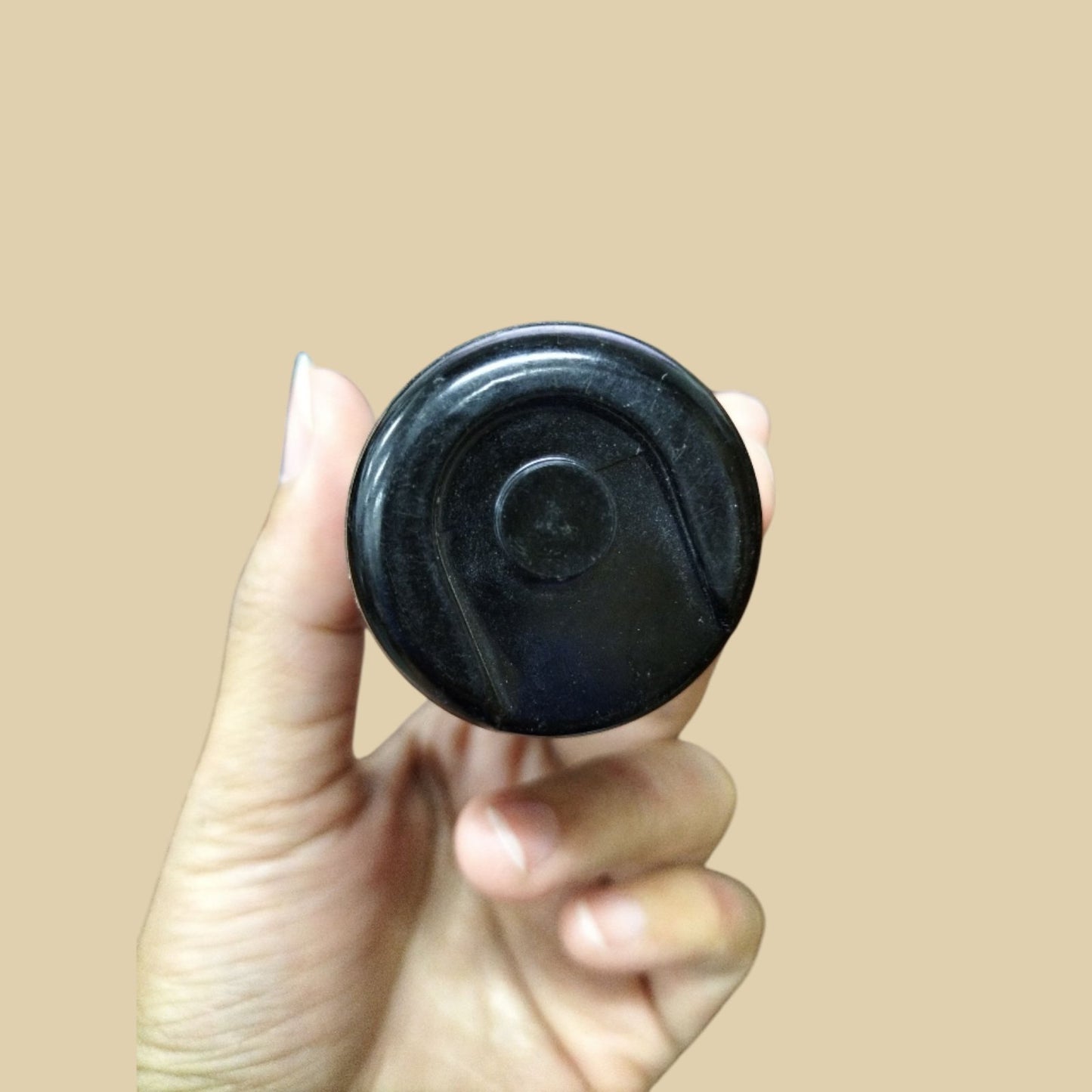 Mallory Starting Capacitor 72-86MFD held in hand, designed for reliable electrical performance