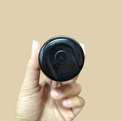 Mallory Starting Capacitor 72-86MFD held in hand, designed for reliable electrical performance