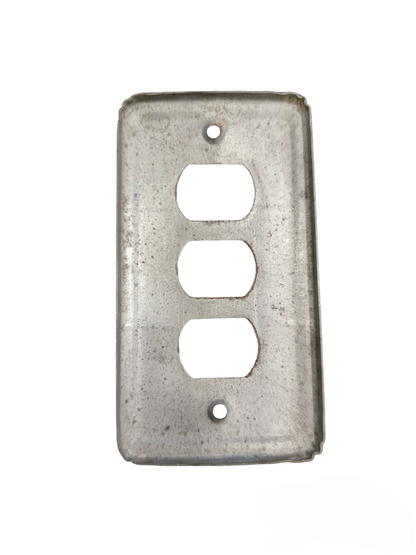 Metal switch cover 3 gang from China with a raw, industrial finish for power points and plugs