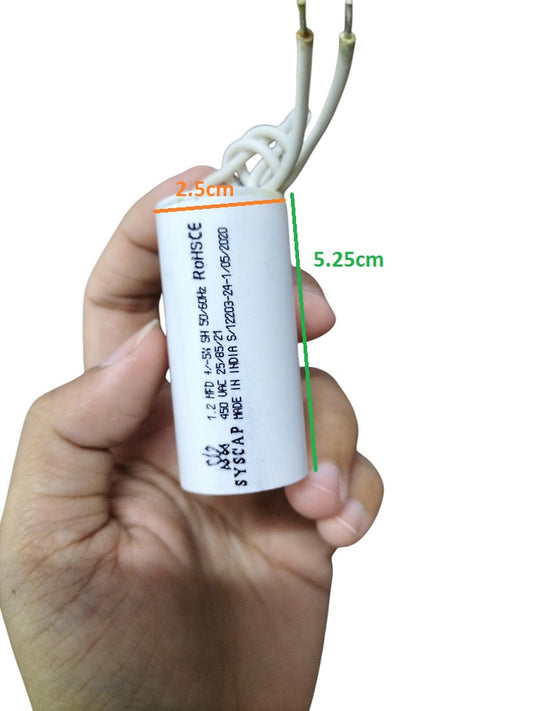 Syscap Motor Running Capacitor 1.2MFD 450v held in hand showing size and wiring