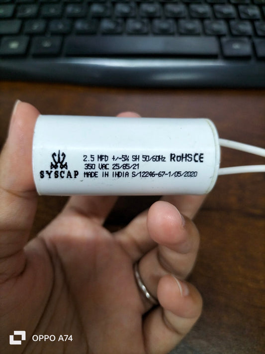 Syscap Motor Running Capacitor 2.5MFD white cylindrical electrical component held in hand