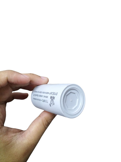 Syscap Motor Running Capacitor 250 VAC held in hand for electrical circuit applications