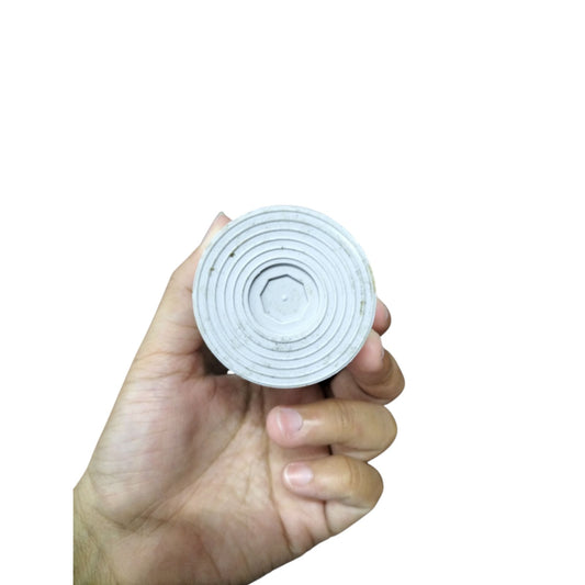 SYSCAP motor running capacitor 40uF 500V held in a hand showing circular design