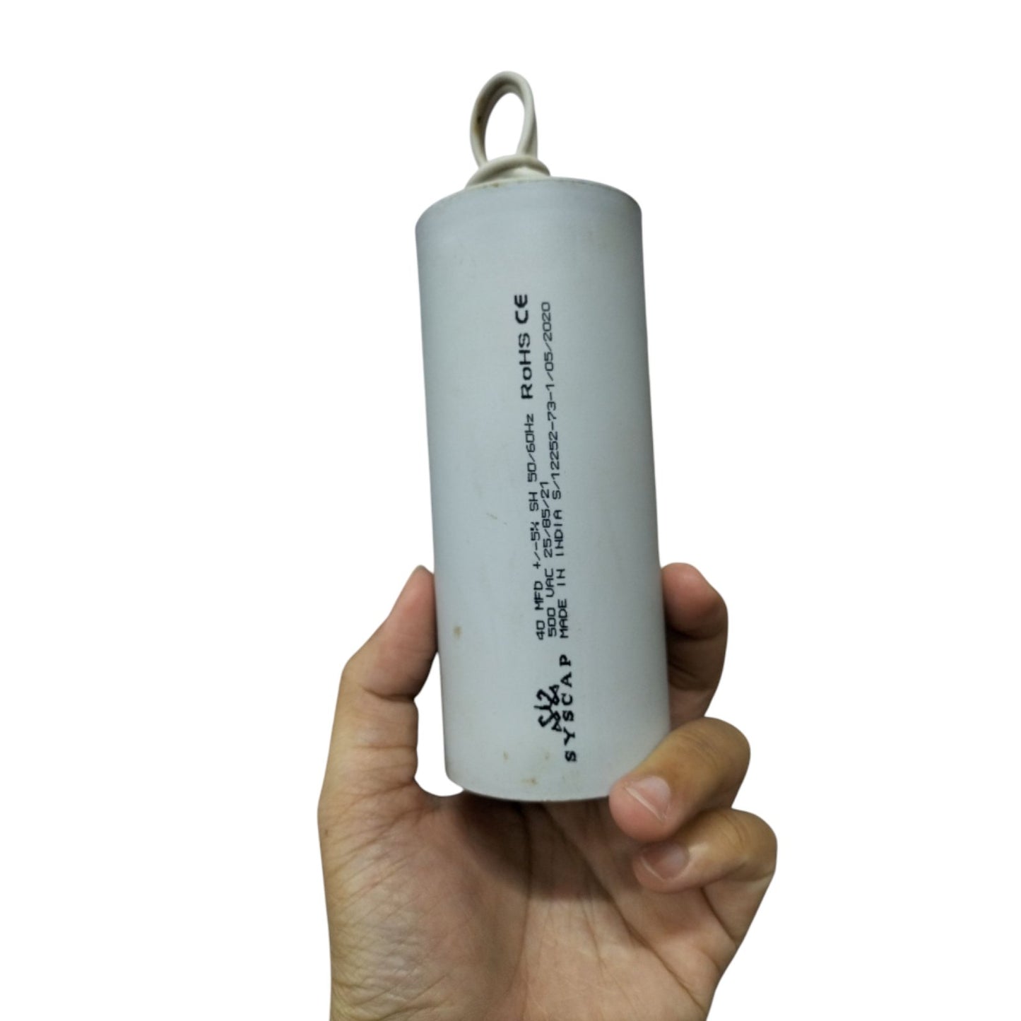 SYSCAP motor running capacitor 40uF 500V held in hand for electrical applications