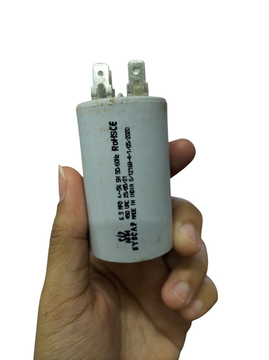 Syscap Motor Running Capacitor 6.5MFD 450V white cylindrical electrical component held in hand