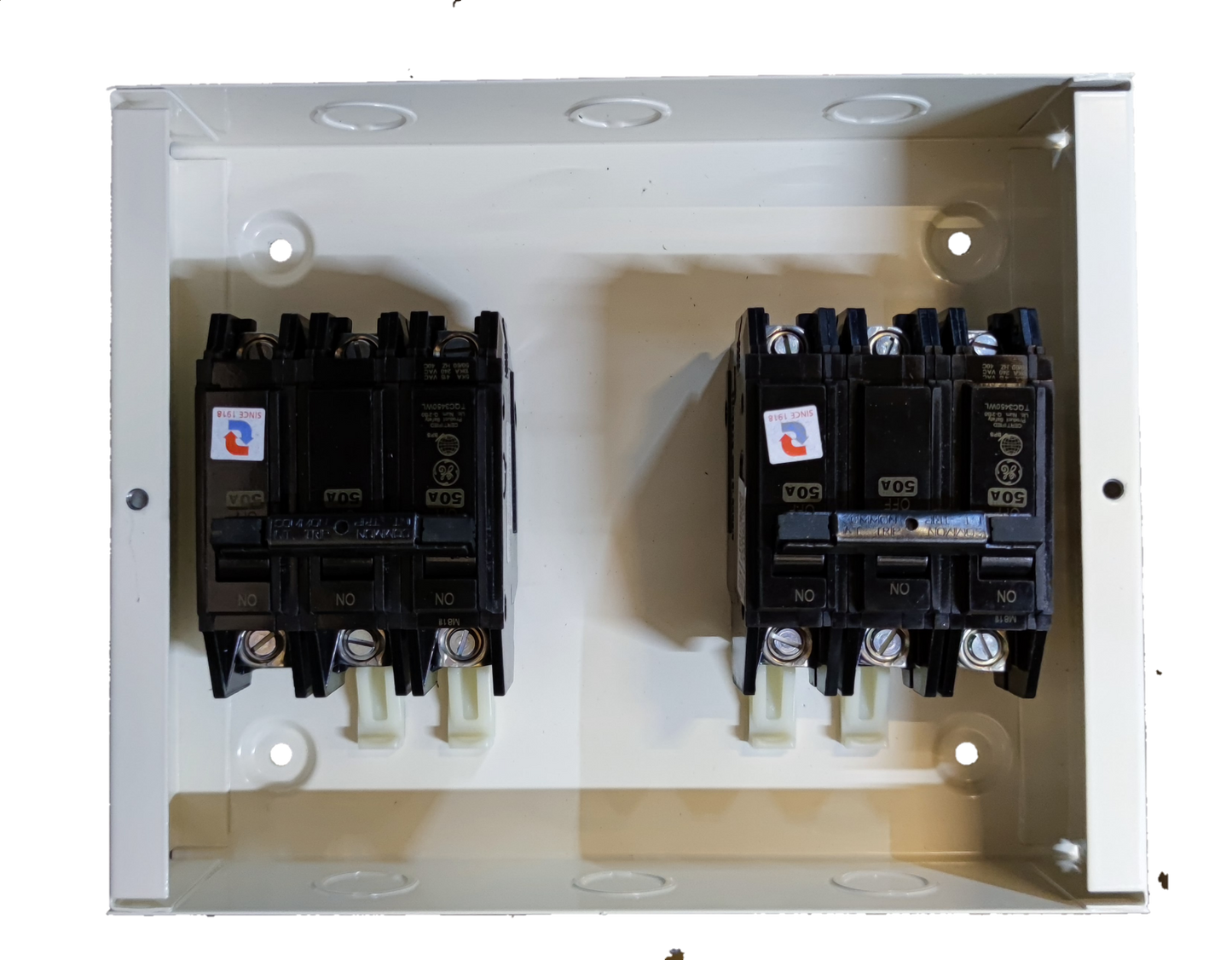 MTS 40A 3 Pole Three Phase electrical circuit breakers mounted on a white panel box