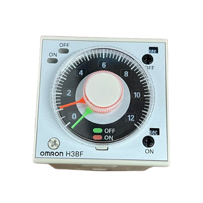 Omron timer relay 220V AC with circular dial for adjustable timing settings in a compact design