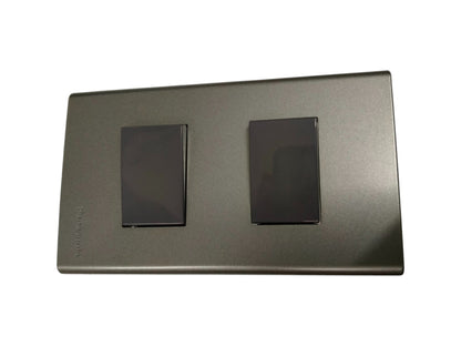 Panasonic 2 gang combination switch with two black rocker switches on a gray plate