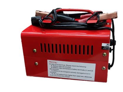 Panther 6V 12V car battery charger in red with attached clamps and warning label
