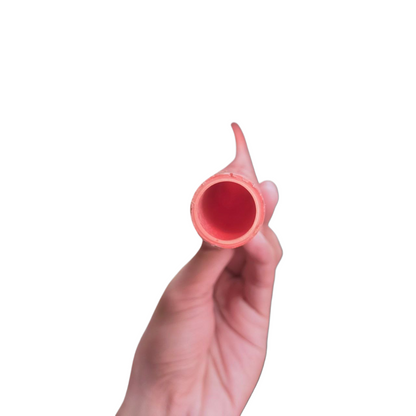 Hand holding 40mm PVC electrical conduit pipe in red showing pipe opening and texture