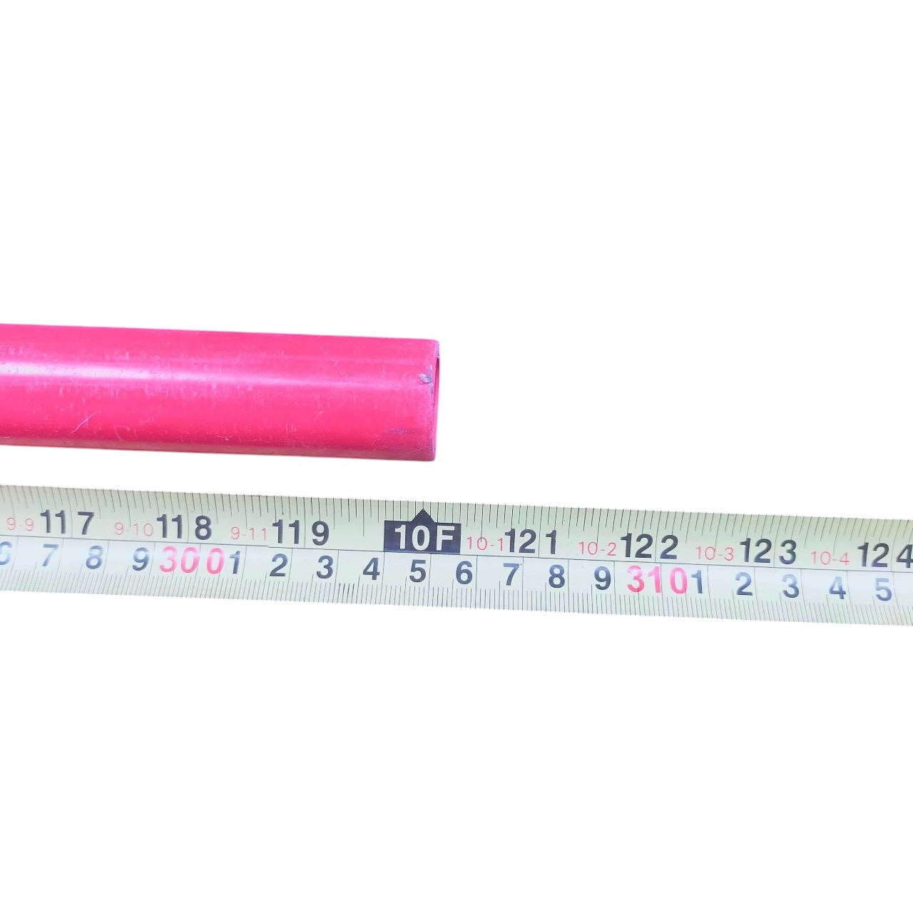 40mm PVC electrical conduit pipe in red shown next to measuring tape for size reference