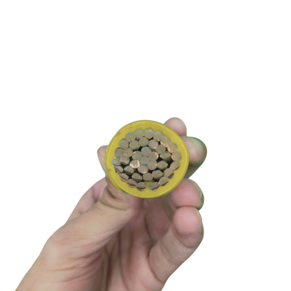 Close-up of hand holding Philflex THHN wire 500mm stranded showing copper strands and yellow insulation