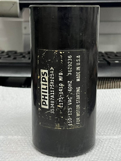 Philips 1175-1410MFD motor start capacitor in black cylindrical casing for electrical circuitry