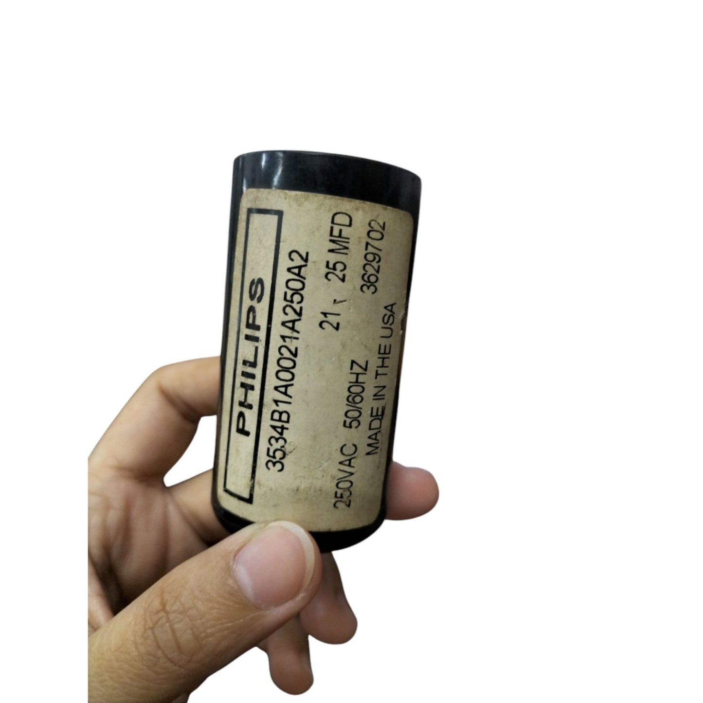 Hand holding Philips Motor Capacitor 21-25uF 220V for electrical applications and circuit repairs