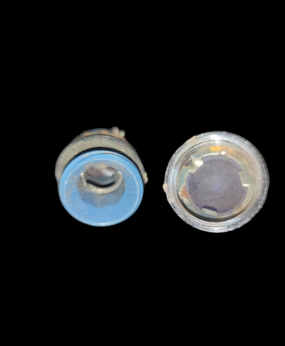 Close-up of two Taiwan-made Pilot Lamp Fixture E10 14mm work and safety lights on black background