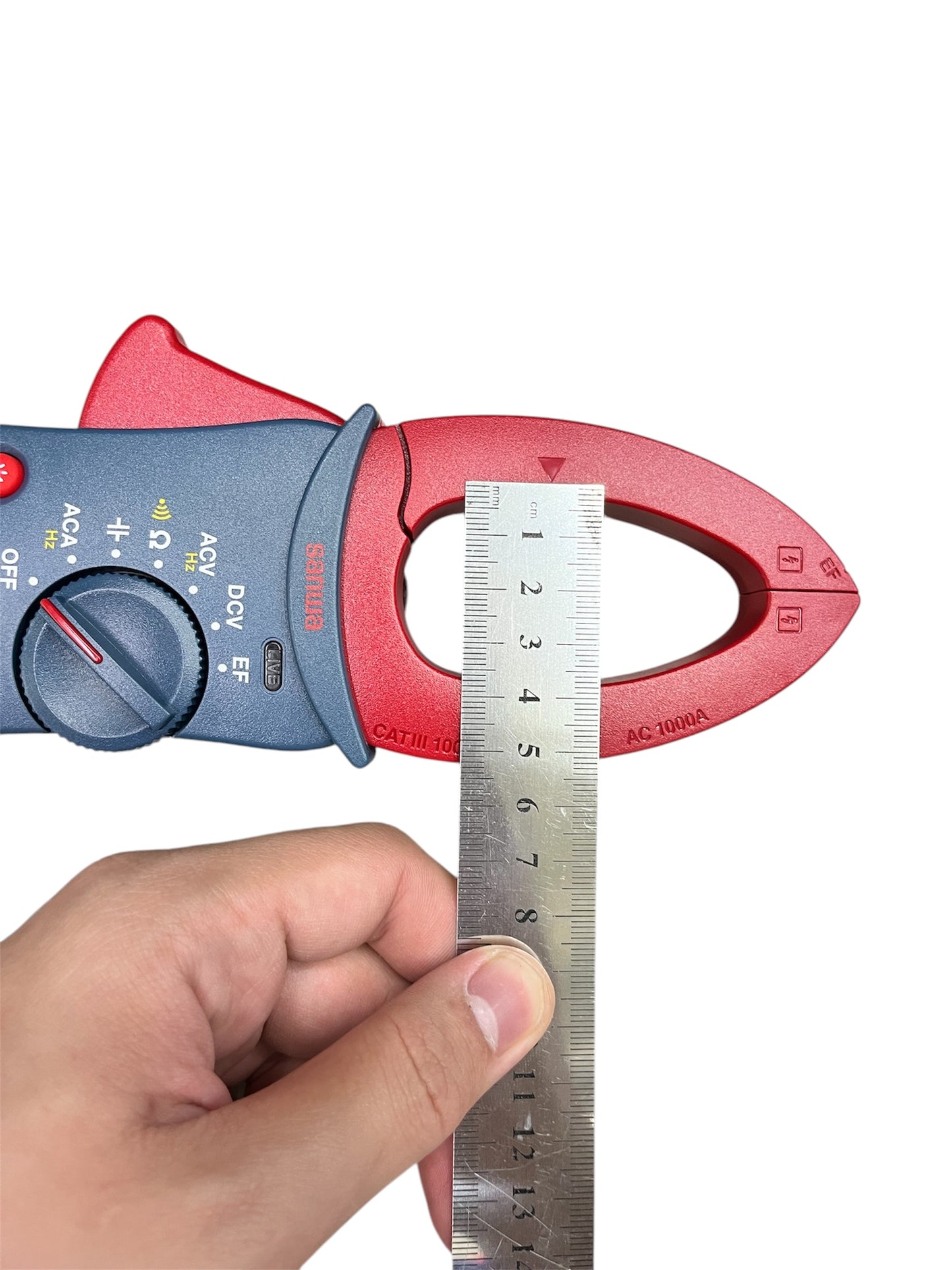 Sanwa Digital AC Clamp Meter DCM301 with red clamp and hand holding ruler measuring clamp size