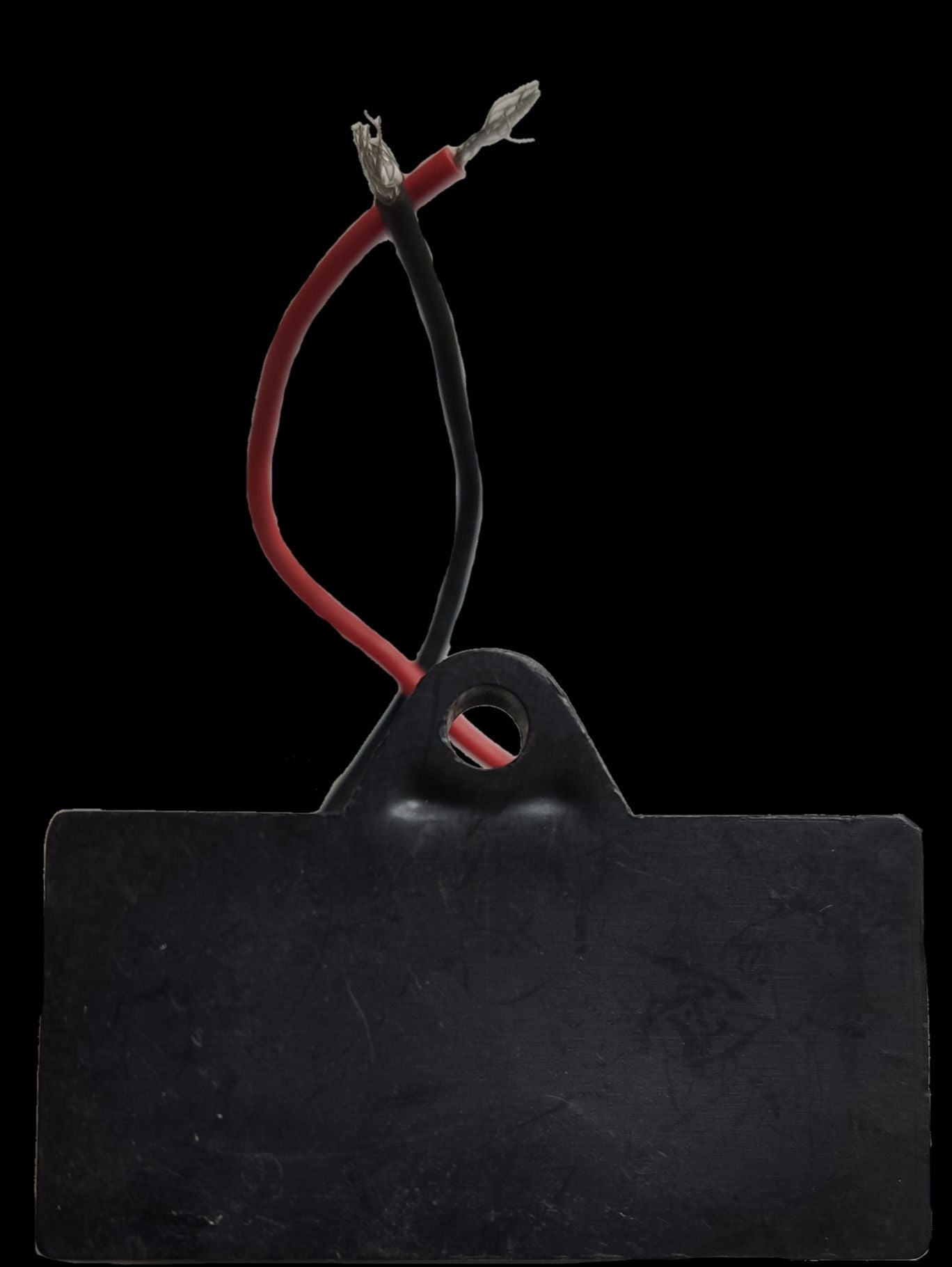 Motor Capacitor 12uF 450V AC with black rectangular body and red and black wires for electrical circuitry