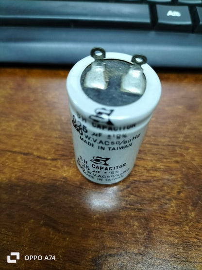 SH Motor Running Capacitor 0.25UF 660V AC cylindrical electrical component on wooden surface