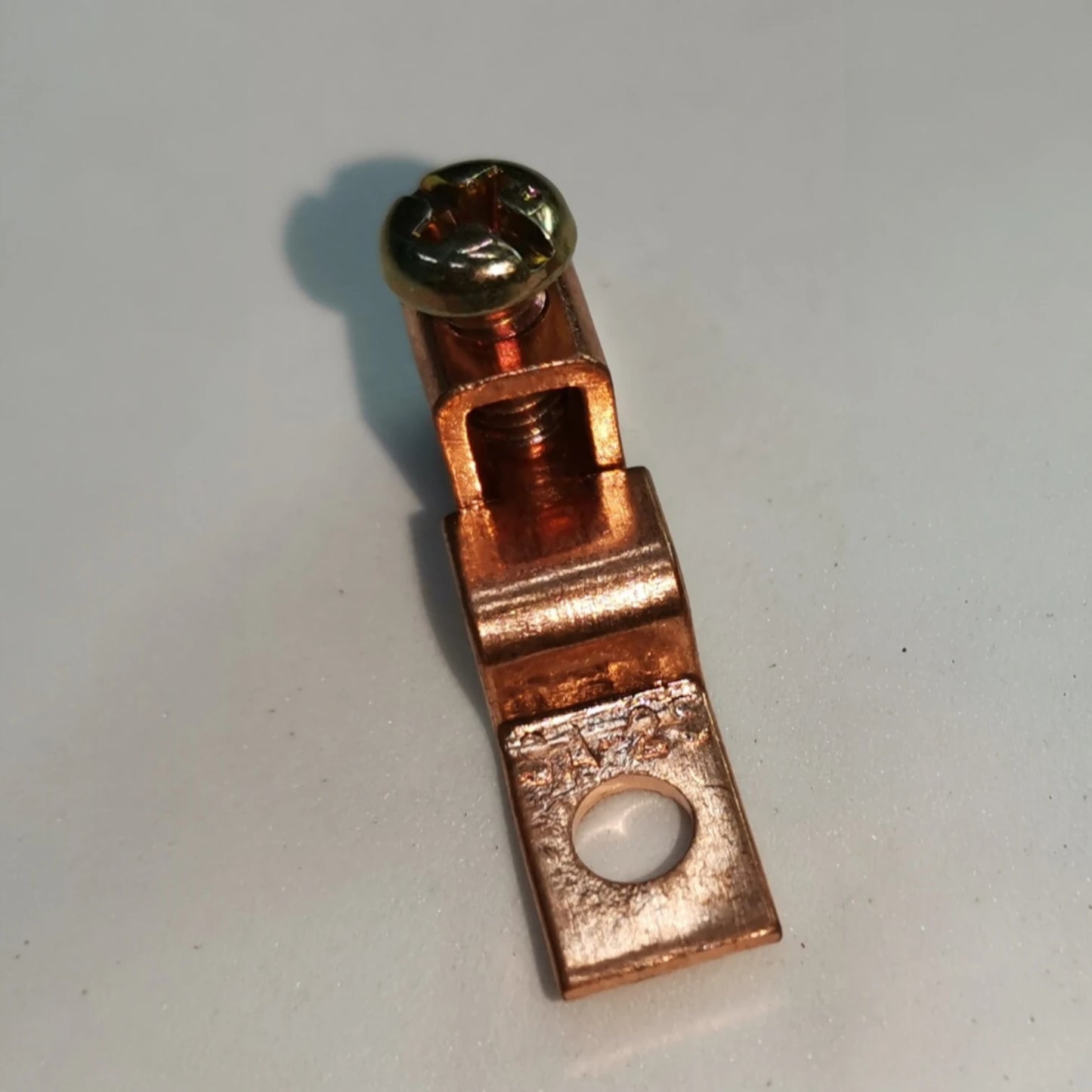 Copper electrical connector on a white background Solderless Terminal Lugs 3.5mm - 5.5mm Wire Size Copper, SA-25