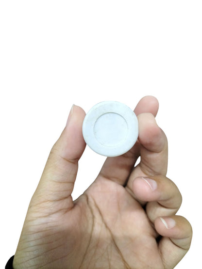 Hand holding Syscap 3.75uF 250V AC capacitor for electrical circuitry applications