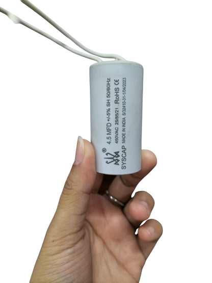 Syscap 4.5MFD motor capacitor white cylindrical electrical component held in hand