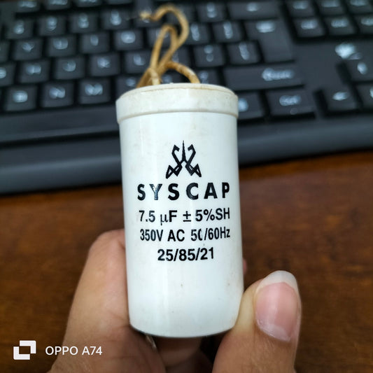 Syscap 7.5MFD Motor Running Capacitor white cylindrical electrical component held in hand
