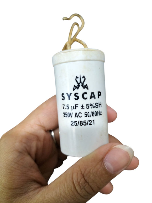 Syscap 7.5MFD Motor Running Capacitor held in hand for electrical circuitry and motor use