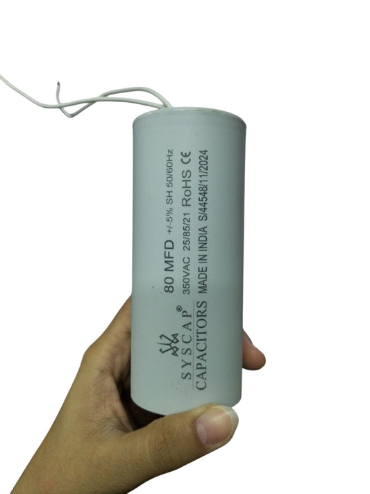 Syscap 80MFD 350V ACRunning Capacitor held in hand for electrical circuitry and parts