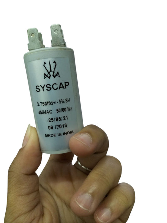 Hand holding SYSCAP motor capacitor 3.75MFD white cylindrical electrical component