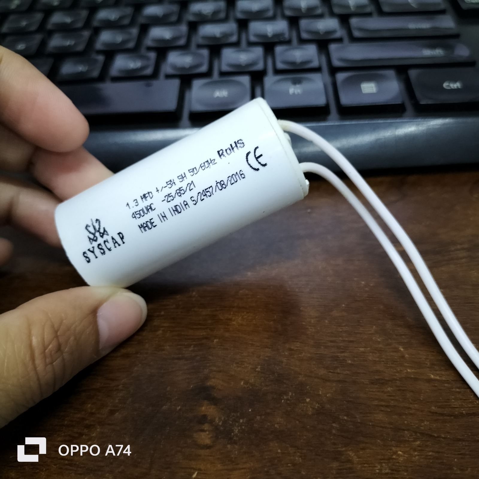 Syscap motor running capacitor 1.3mfd white cylindrical electrical component with wire leads