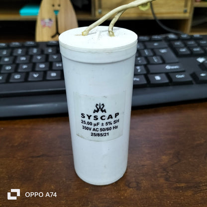 Syscap Running Capacitor 25MFD 350 VAC cylindrical electrical component with wires on wooden desk
