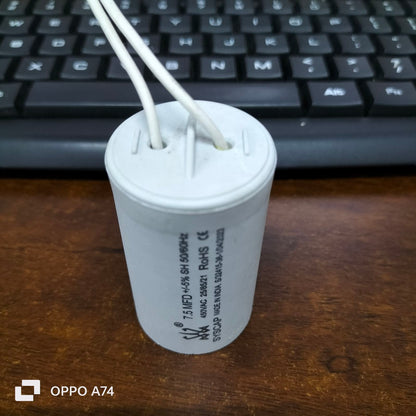 Syscap Running Capacitor 7.5MFD 450 VAC white cylindrical electrical component with two white wires