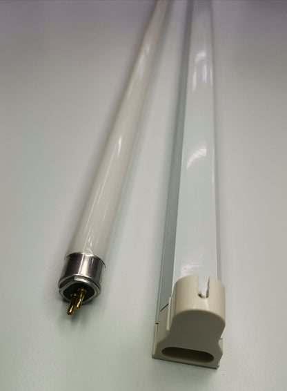T5 colored fluorescent lamp 220V tube with metal pins and plastic socket connector on white background