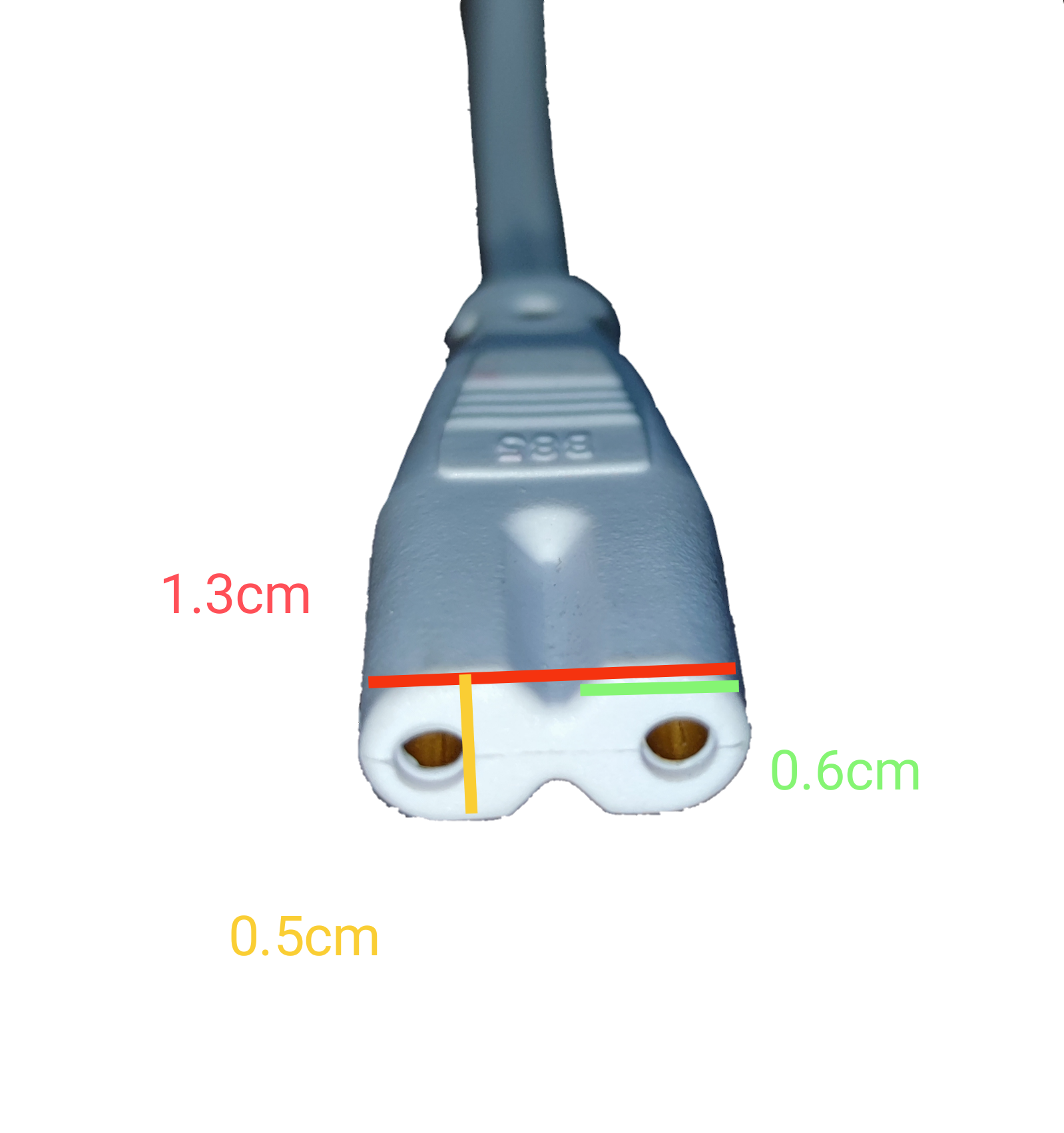 T-5 AC Connector 2 Pins white 2-pin power plug close up with cable and measurement markings on black background
