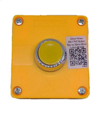 Auspicious yellow push button switch mounted on a square yellow PVC box with metal screws